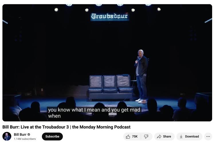 Bill Burr performs live on stage at the Troubadour as part of the Monday Morning Podcast—an example of a podcast delivered through comedy and live storytelling.