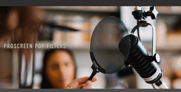 Proscreen pop filter attached to a microphone on a boom arm to reduce plosive sounds during podcast recording.