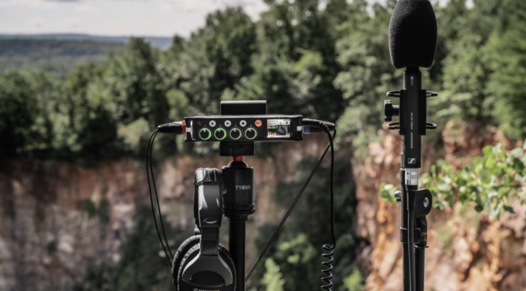 Best podcast mixer Sound Devices MixPre-6 II setup with headphones and microphone outdoors