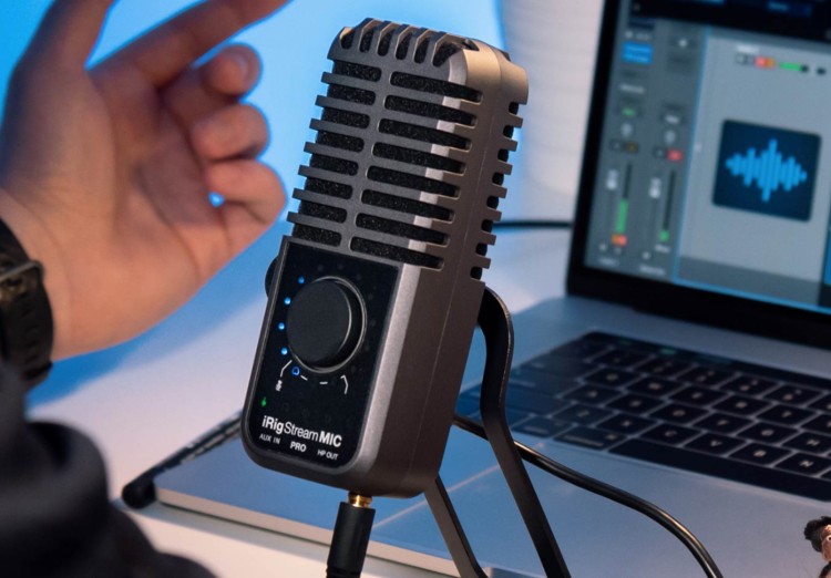 Close-up of the iRig Stream Mic Pro connected to a laptop, used for high sound quality recordings