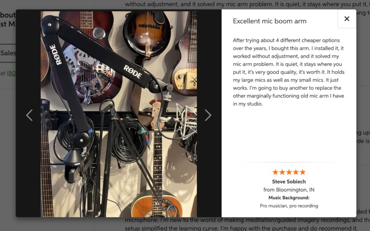 Rode PSA1+ microphone boom arm shown in a home recording setup with guitars and cables, alongside a customer review praising its quality and ease of use