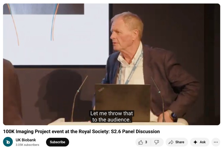 Panel moderator building rapport with the audience during the 100K Imaging Project event at the Royal Society while speaking on stage