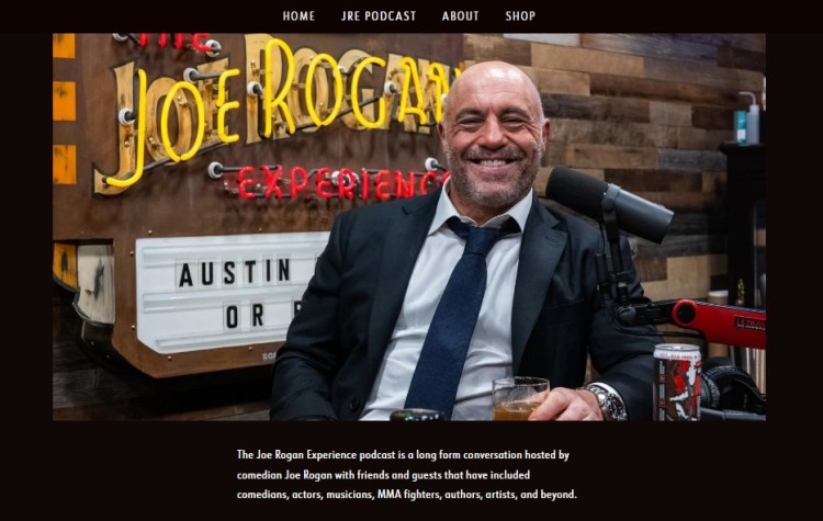 Screenshot of Joe Rogan smiling in the podcast studio for The Joe Rogan Experience, highlighting one of the most impactful shows in modern podcasting.