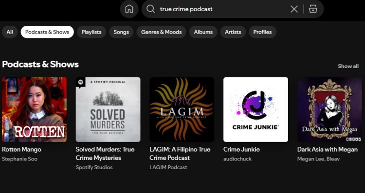 Spotify search results showing popular true-crime podcasts including Rotten Mango, Solved Murders, Crime Junkie, and Dark Asia with Megan.