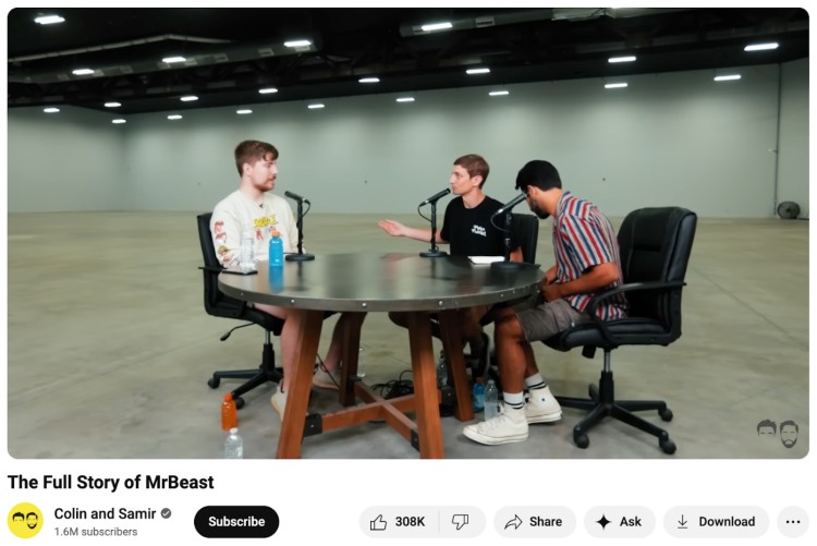 Colin, Samir, and MrBeast recording a podcast at a round table inside a large empty studio with a distraction-free background.