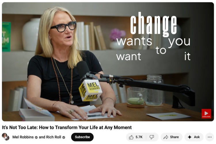 Mel Robbins speaking into a studio microphone with shelves, books, and décor behind her, offering background ideas you can use for creating a warm and professional podcast setup.