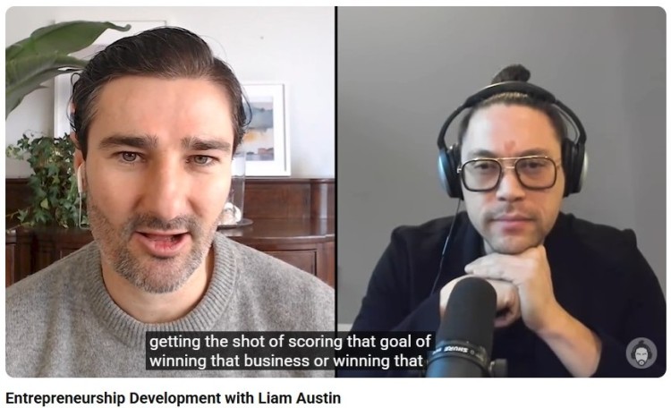 Liam Austin speaking with a host during a podcast episode interview about entrepreneurship and business growth.