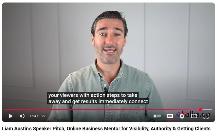 Liam Austin delivering a speaker pitch on video, explaining how to provide value and action steps for audiences, with on-screen captions and a focus on podcasting visibility and authority.