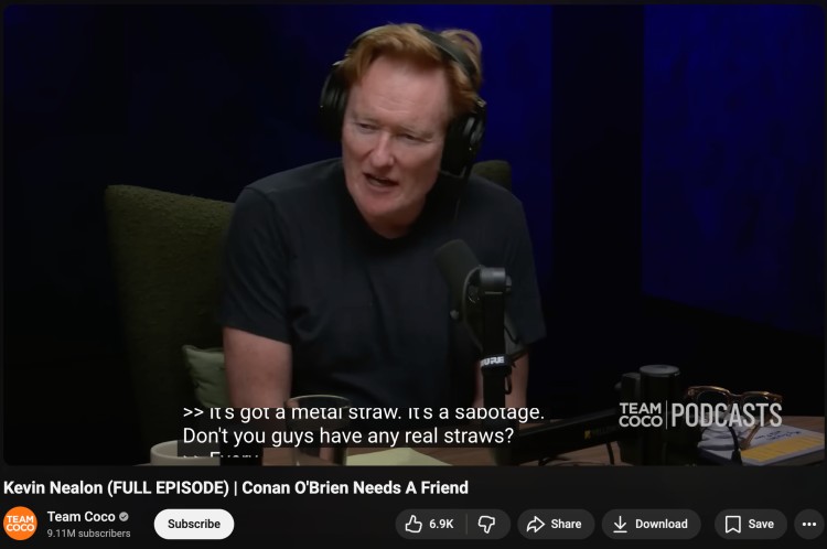 Comedy podcast guest speaking into a microphone during an episode that encourages audience participation through humor and storytelling.