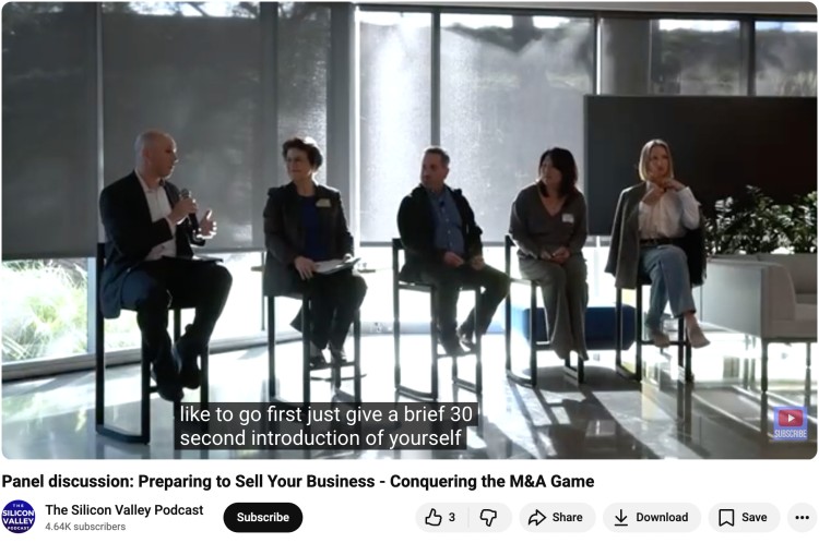 In-person panel discussion with business leaders seated on stage, introducing themselves and sharing insights at a live event.