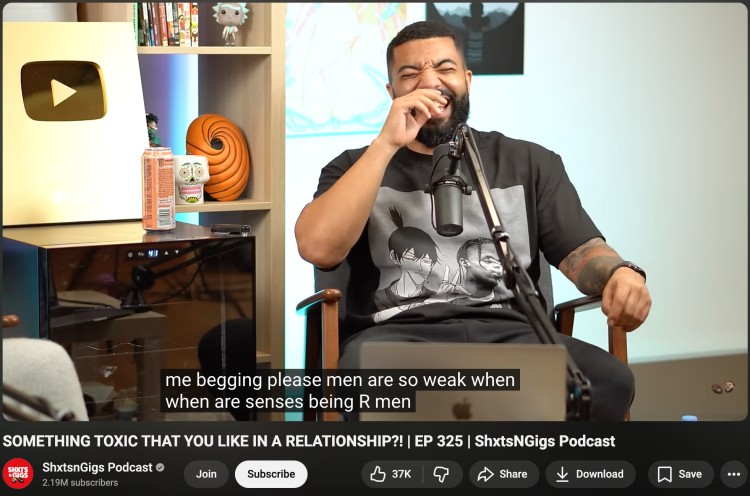 Podcast host reacting with spontaneous laughter during a candid comedy podcast recording.