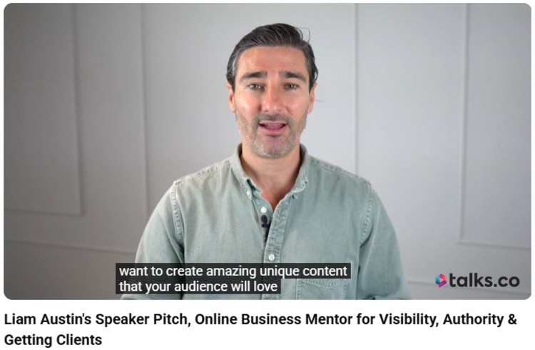 Liam Austin delivering his speaker pitch about visibility and authority, sharing insights on launching a podcast and creating content that attracts clients.