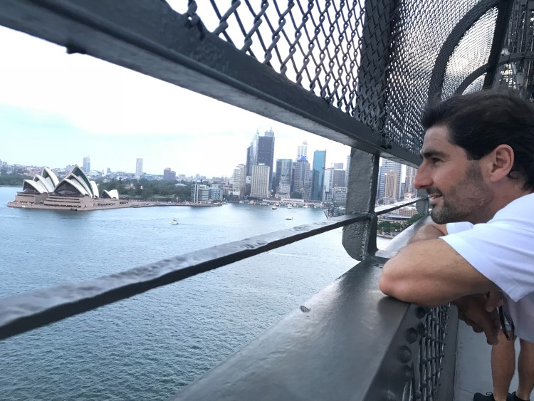 Liam overlooking Sydney Harbour and the Opera House, thinking of deep questions while reflecting on ideas for meaningful conversations.