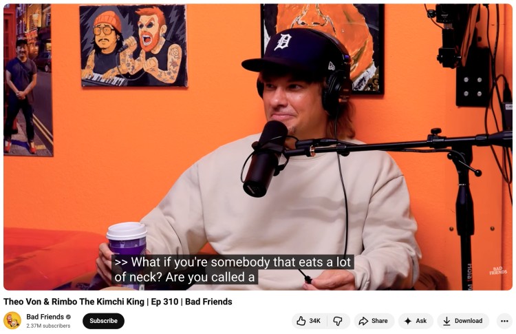 Podcast host in studio asking funny questions during a casual interview