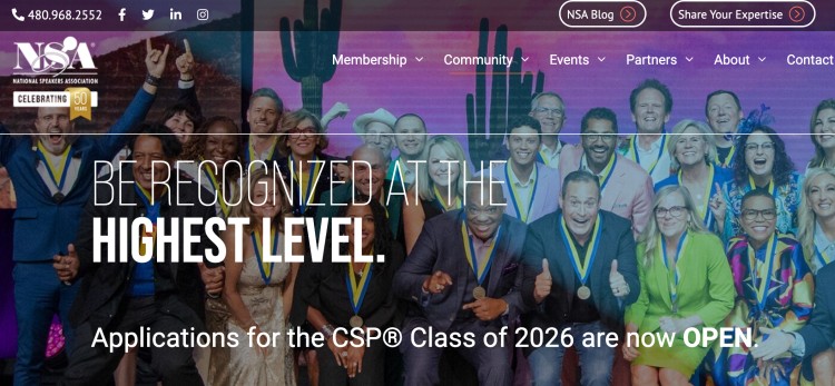 Professional public speaker recognition event showing group of speakers celebrating achievement at a high level certification program