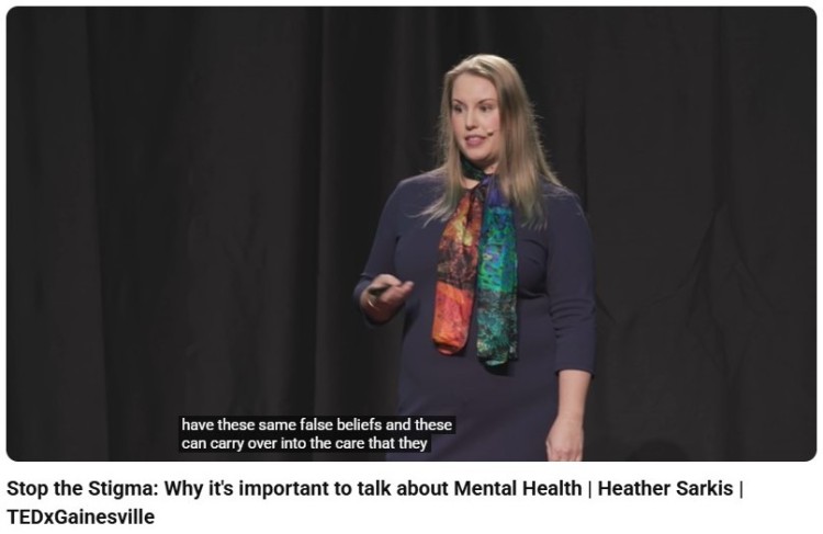 TEDx speaker delivering a powerful and persuasive talk about mental health awareness and breaking social stigma.