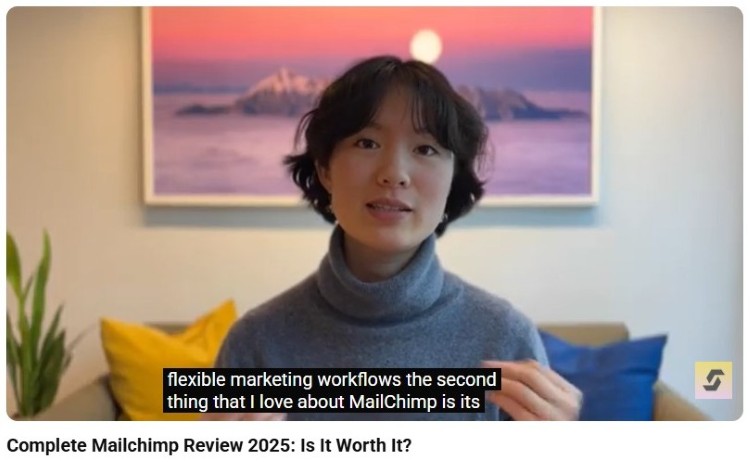 Video reviewer discussing Mailchimp's advanced features and marketing automation capabilities