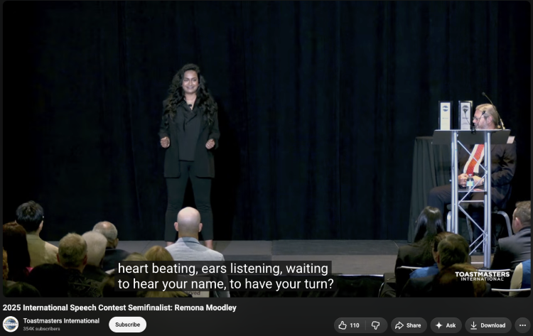 Speaker on stage in a speech contest preparing to demonstrate her extemporaneous speaking skills