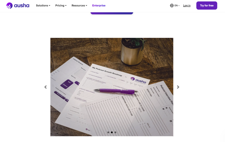 Ausha podcast growth roadmap with printed worksheets for podcast planning and production, content strategy, and growth goals.