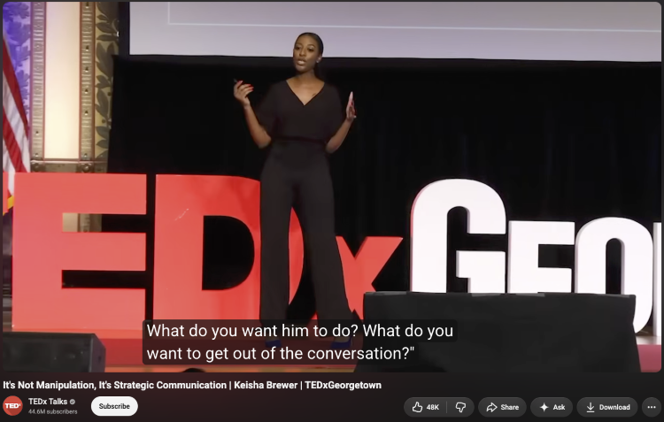TEDx speaker using hand gestures while delivering a persuasive talk on strategic communication