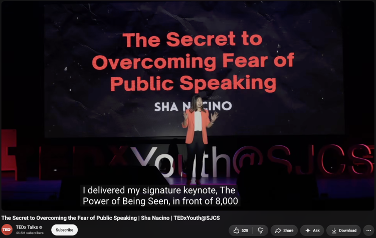 TEDx speaker discussing overcoming fear while standing front of an audience